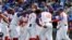 El equipo cubano celebra la victoria sobre Taiwán. (AP/I-Hwa Cheng)