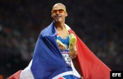 El dominicano Félix Sánchez celebra al ganar la prueba de 400m vallas, en Londres 2012.