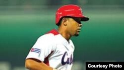 A man traveling on a motorbike taxi in the streets of Santiago de Cuba. Around 16,000 motorcycles of various makes, models and nationalities are on the streets every day as private taxis in Santiago de Cuba.