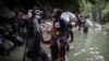 Migrantes de Haití cruzando la selva del Darién entre Colombia y Panamá, el 9 de mayo de 2023. (AP Photo/Iván Valencia).