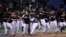  Los jugadores holandeses celebran tras imponerse a Cuba en un partido de segunda ronda del Clásico Mundial de Béisbol disputado en el estadio Tokyo Dome hoy, lunes 11 de marzo de 2013 en Tokio (Japón). 